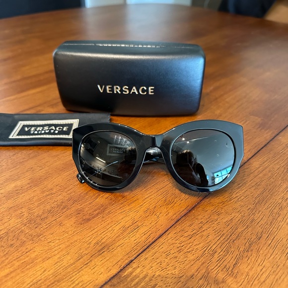 Versace black sunglasses with gold emblem on both sides main image 3